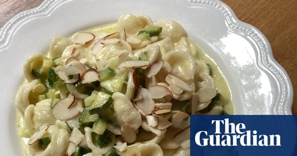 Rachel Roddy’s recipe for orecchiette with courgettes, parmesan cream and almonds | Food