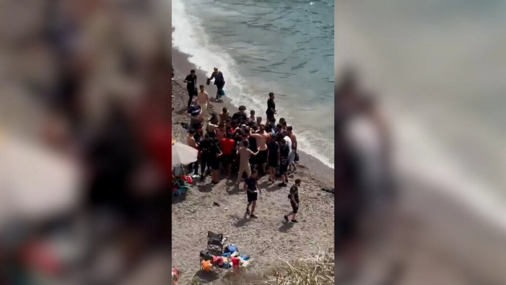 Dozens of migrants land on Spanish coast surprising beachgoers | Politics