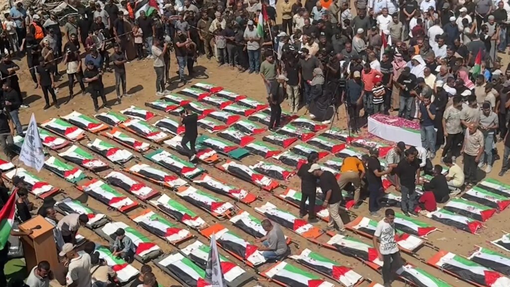 Mass funeral held for 112 members of two Palestinian families | Gaza News